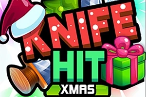 Veitsen terät puuttuvat puiseen kohteeseen, jossa on teksti KNIFE HIT XMAS joululahjan ja tonttulakin vieressä