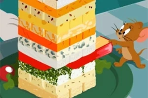 Hiiri ottaa palikkaa tornista, joka on rakennettu erilaisista juustoista ja vihanneksista lautasella